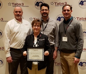 Charlotte Quiroz and Van Swearingen gladly accept Tabs3 Billing Consultant of the Year on behalf of Baker + Cadence Solutions.
