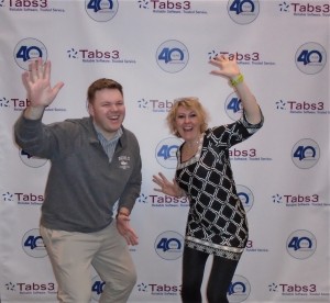 Jenny Policky and Chris Ames take an opportunity to pose in front of STI’s 40th anniversary banner.