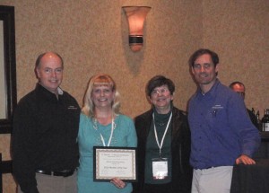 Sandy Adams and Britt Lorish accept Reseller of the Year award for Affinity Consulting.  They were also recipient of the Platinum Reseller of the Year.