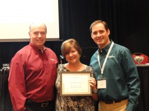 Edie Zimmerman gladly accepts her Tabs3 Reseller of the Year award.