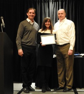 Monica D’Amore collects her Single Site Platinum Reseller of the Year award.