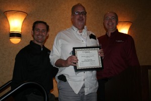 Paul Purdue proudly displays his Platinum award.